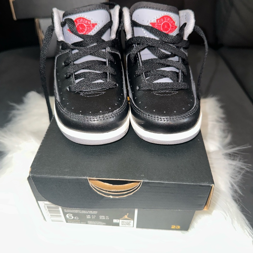 Jordan Kids Black and Gray Sneakers with Red Accent